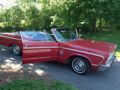 1966 fury iii,  two door, red w/ black convertible top.