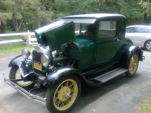 1929 model a ford coupe, great driver, 5 window, rumble seat