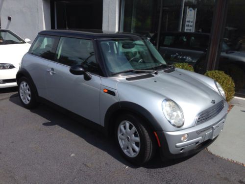 Silver mini cooper  with black interior, clean car. 2dr hatchback abs -