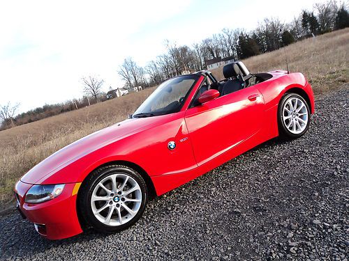 Gorgeous red/black z4 3.0l*6speed*power top*heated seats*low miles*$19997/offer!