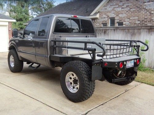 F250 superduty 4x4 custom air suspension lifted flat bed