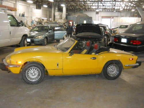 Yellow 1978 triumph spitfire convertible