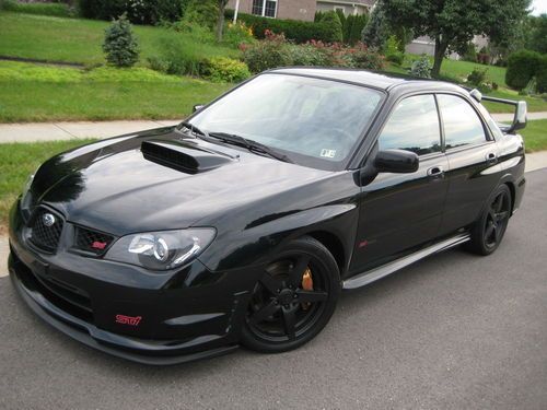 2006 subaru  impreza wrx sti black 36k miles lots of upgrades. 6 speed gorgeous!