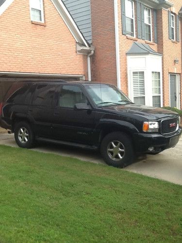 Black yukon denali. 4-door, over 200 miles.