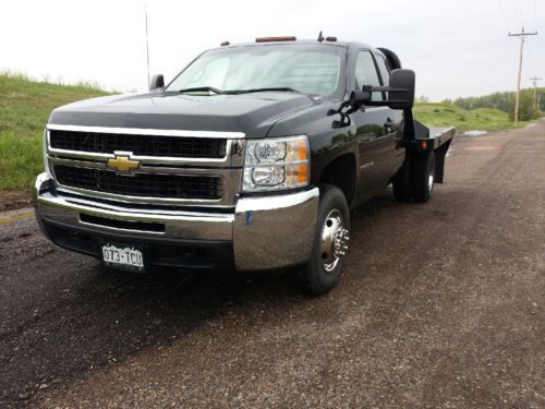 2007 black flatbed dually 6.6 duramax