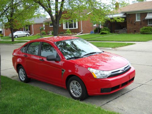 Red,black cloth  interior excellent conditon 4 door sedan 34000 miles