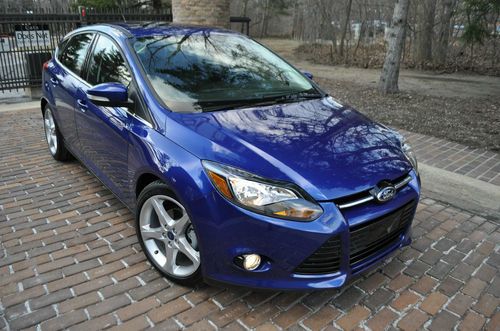 2012 focus titanium.no reserve.leather/navi/moonroof/sync/18's sport /rebuilt