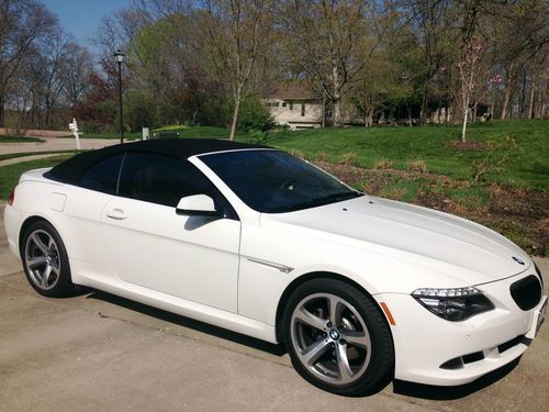 Excellent condition 7249 miles  white/black convertible top