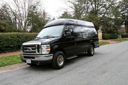 Black 2008 ford e-250 executive limousine van