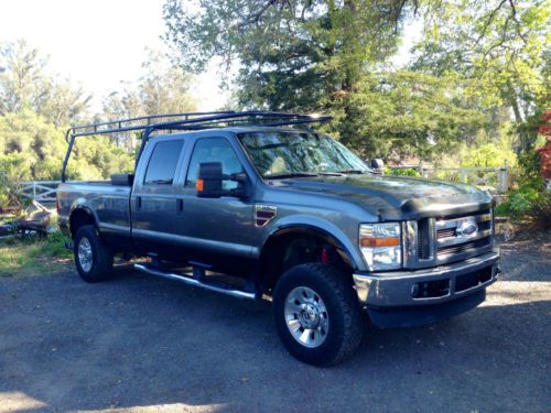 Ford f-350 lariat crew cab pickup with snugtop (5.4l v8 4x4 6-speed manual 8.2)