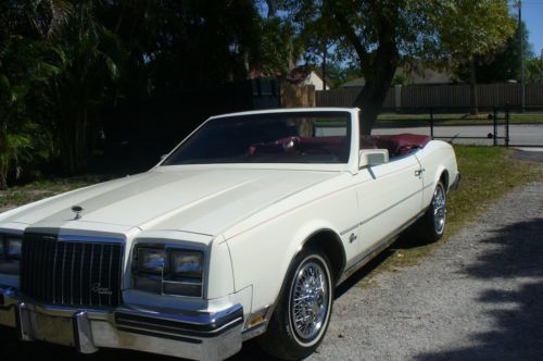 Convertable,one owner,white with burgandy interior, never smoked in, garaged,