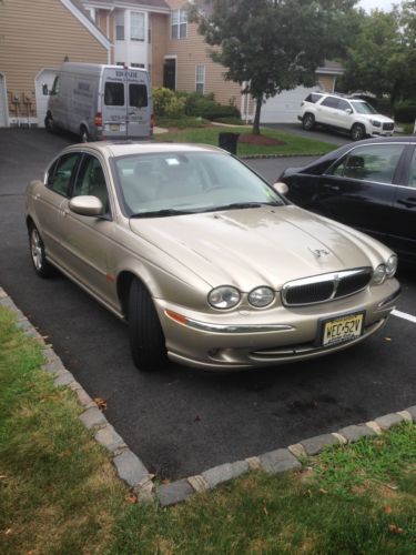 Jaguar 2002 x-type gold 4 door sedan 3.0l v6 75,375miles