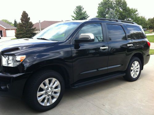2011 platinum toyota sequoia w/extended warranty. black.