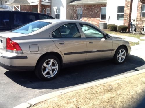 Gold 4 door volvo  with sunroof,  heated leather seats and  power everything