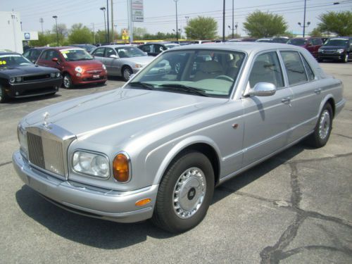 Real nice silver sedan with conley leather inside and lambs wool floor mats.