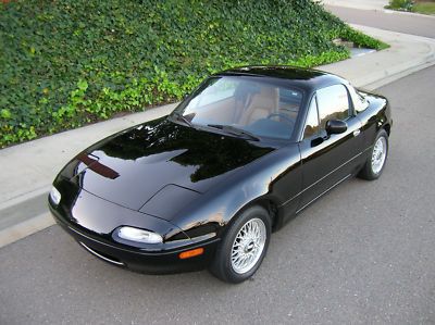 1992 mazda miata, black and tan, less than 20k miles!