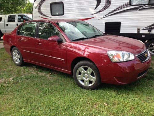 2006 chevy malibu lt, 4 cyl, auto, a/c, pwr doors, red exterior, gray int.