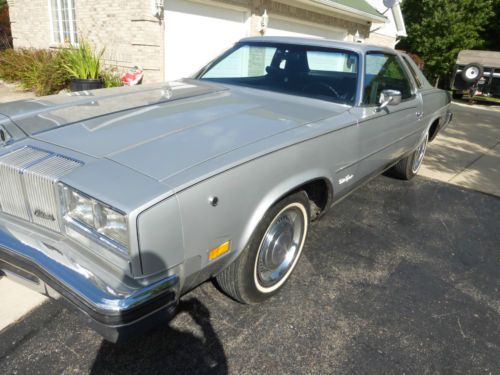 1976 cutlass , silver, 2 dr, 2 owner , same family, 6,913 actual miles, original