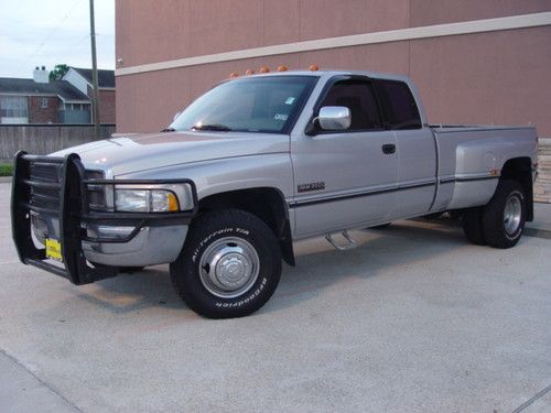 5.9l td 5 speed dully air suspension brand new tires cd player cold ac slt