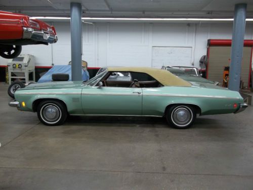 1973 delta 88 royale convertible good condition green w/ butternut top nice car