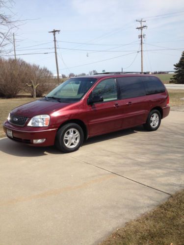 Deep red van with tow hitch, luggage rack, power sliding doors - good condition