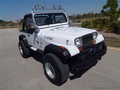 Yj 4.2l i 6 speed lifted 33" rims lights carfax serviced florida wrangler cj