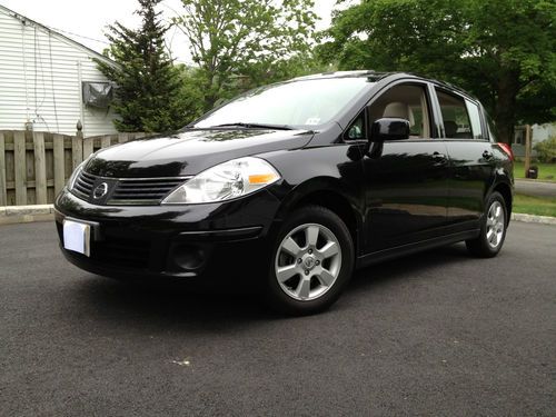 Nissan versa 1.8 sl hatchback, 2009, black ext, tan int, 50k miles, nj, 33 mpg!