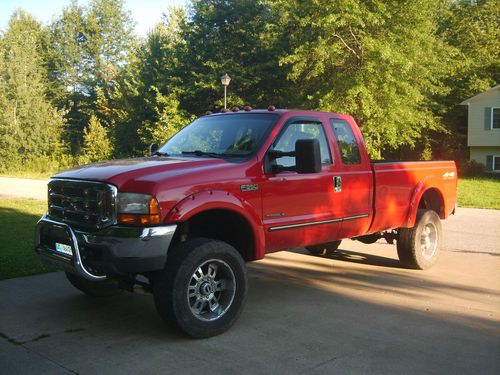 7.3l powerstroke 4x4 diesel ext cab, lifted 6spd manual lariat sharp truck