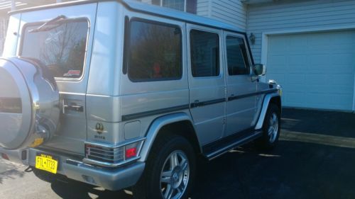 Silver with gray leather interior, fully loaded
