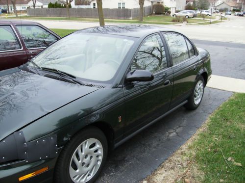 99 saturn ls 2 4dr runs well ac 33mpg hwy  102,000 mi.