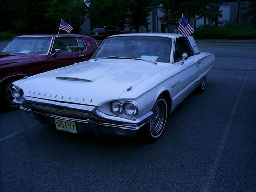 1964 ford thunderbird  white and gold very good condition in and out,