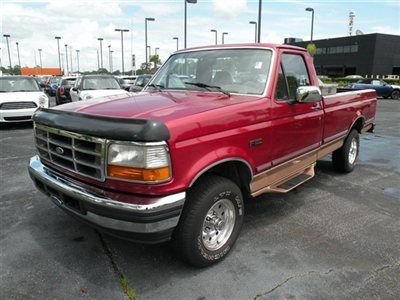 1995 ford f-150 lariat red/beige very good condition.runs well. four wheel drive