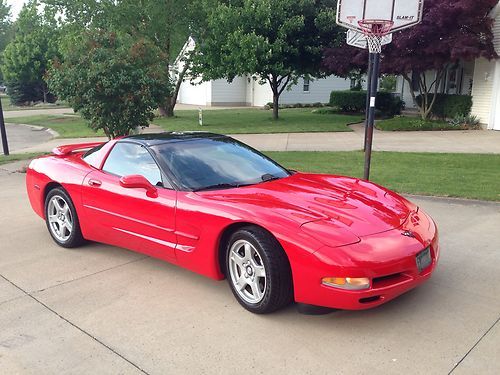 1997 red corvette c5 with rear spoiler, glass targa top and low miles!