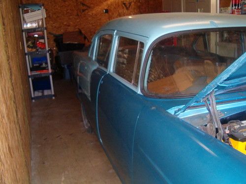 1955 chevy 210 4 door partly restored.with 327 v8 and automatic transmission.
