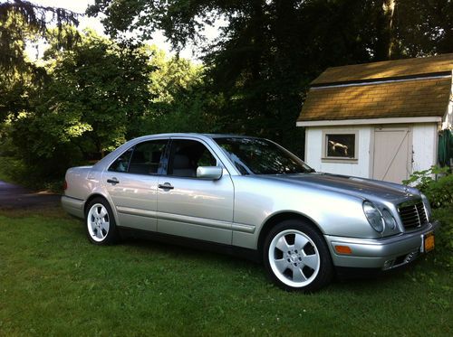 97 mercedes benz e320 39,000 miles silver w gray leather int. mint condition