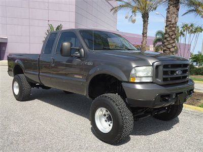 Lifted srw diesel 4x4 xcab long cloth alloys cd like new tires nice truck fl