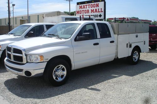Utility bed, quad cab, 2 wheel drive, 5.7 hemi gas engine, nicely equipped!