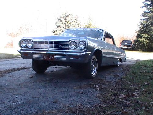 64 impala lowrider with hydraulics. 2 door hard top 100 spoke tru knock off rims