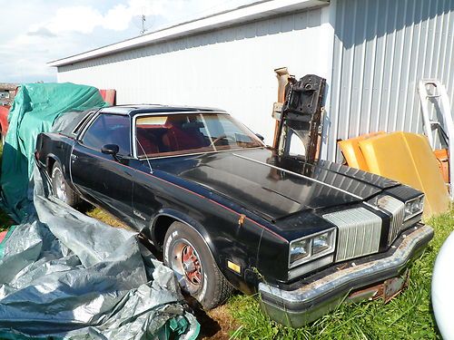 2 1977 olds cutlass supremes with t-tops