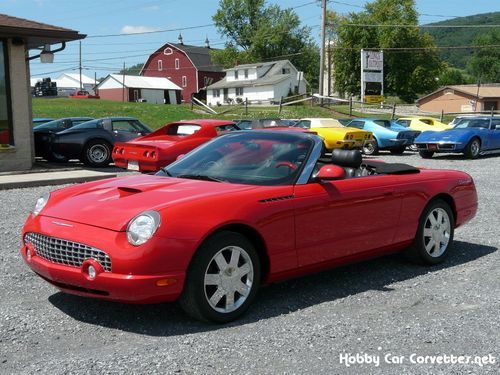 2002 red ford thunderbird convertible 21k miles very nice! 2 tops