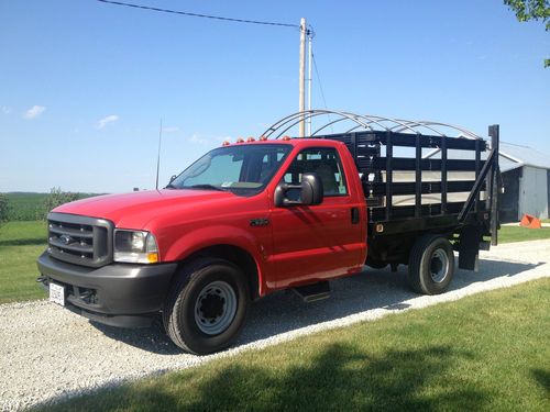 Ford f- 350 super duty stake bed truck with 1600lb lift gate and tarp