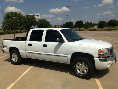 67,000 miles, white, 4wd, crew cab, sle