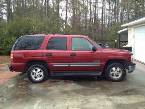 Burgandy paint, tan leather, 4 door, 4x4, 3rd row seating, sunroof