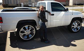 Off-white dodge ram with 26in rims and 2&#034; front end lift with duel exhaust.
