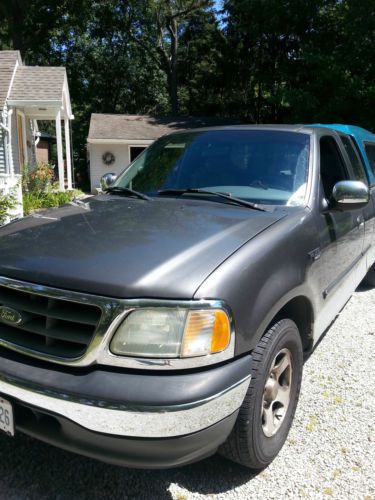 2002 ford f150 xlt extended cab 4 door pickup truck includes cap towing package