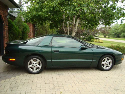 Like new,dark green metalic, 2 door coupe,automatic 4 speed transmission,alarm