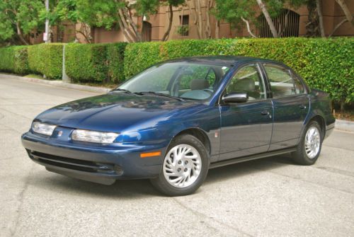 1997 saturn sl2, almost one lady owner, only 63,000 miles!  electric windows,etc