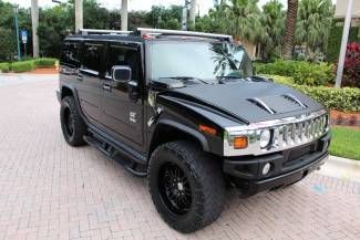 2005 hummer h2 one owner only 27k miles clean carfax,22" custom rims, we finance