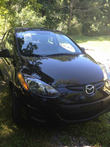 Black 2011 mazda 2 touring hatchback 4-door manual trans.