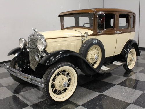 Nicely restored two-tone sedan, color-matched wheels, accurate older resto!